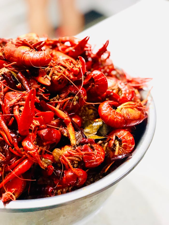 pexels photo 2410606 Close-up shot of a vibrant bowl of boiled crawfish, perfect for seafood lovers.